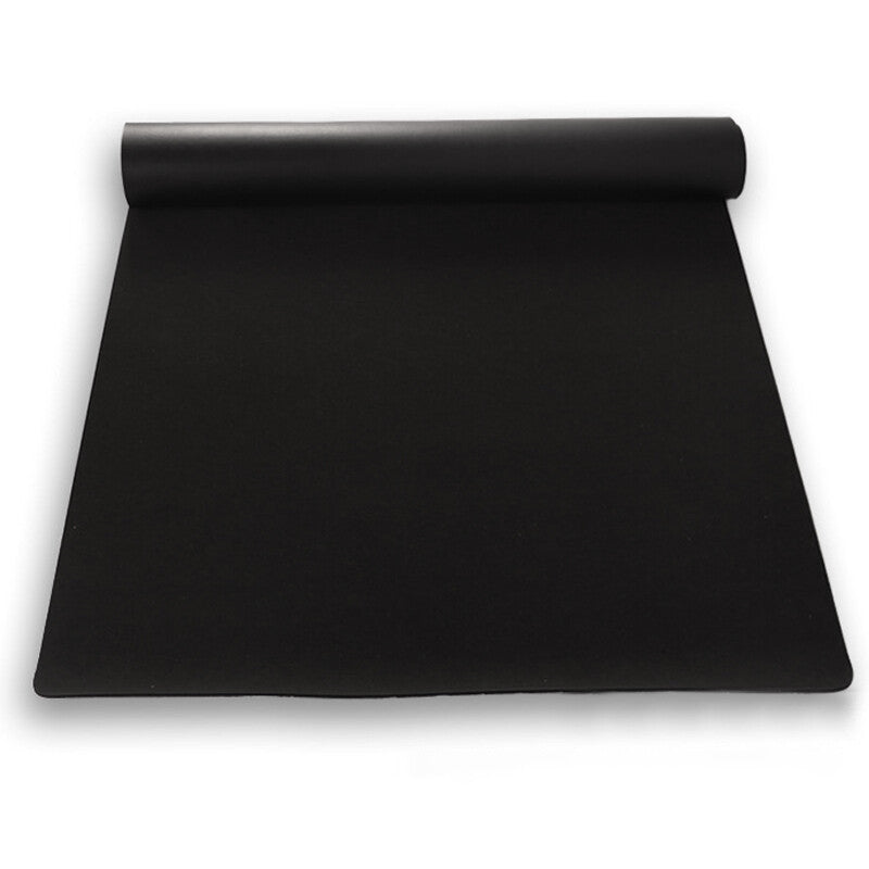 Black yoga mat on a white background