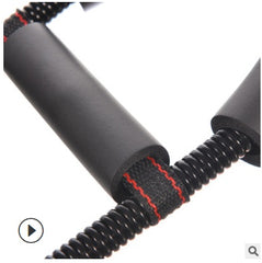 Close-up of a black and red coiled rope on a white background